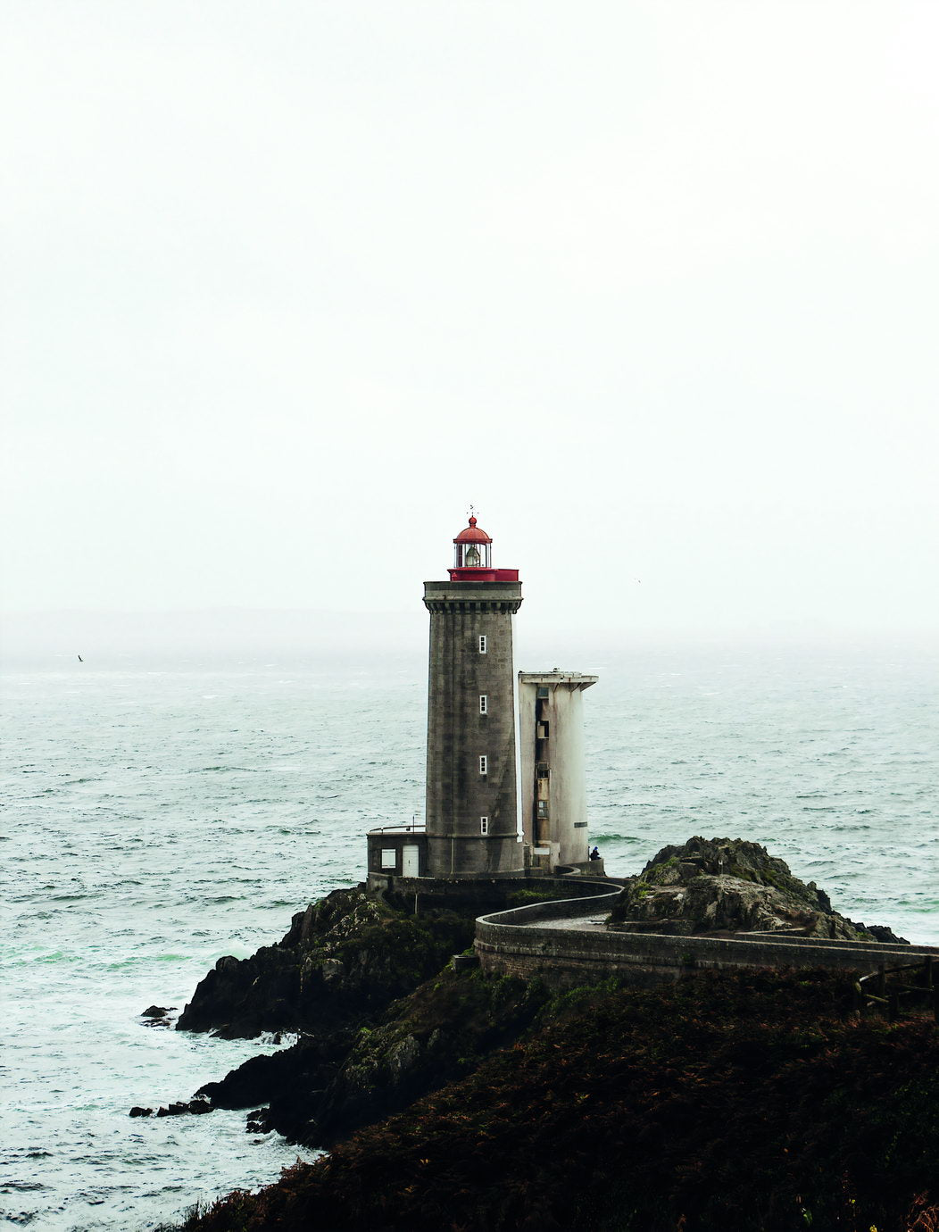 Lighthouse on Rocky Coast Poster Serene Seascape Photography Minimalist Coastal Wall Art Print - xonomax