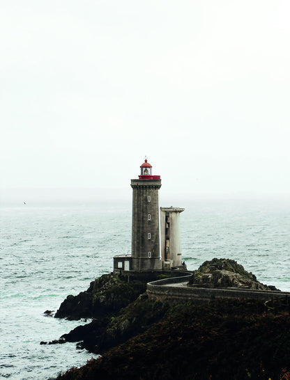 Lighthouse on Rocky Coast Poster Serene Seascape Photography Minimalist Coastal Wall Art Print - xonomax